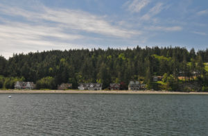 View of property from Penn Cove of Price Sculpture Forest park in Coupeville on Whidbey Island