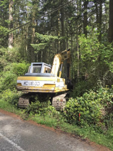 Price Sculpture Forest excavator entering location of future driveway to parking lot