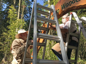 Ken Price and Michael Hauser assembling Wonder In Wonder arch at Price Sculpture Forest Coupeville Whidbey Island sculpture park