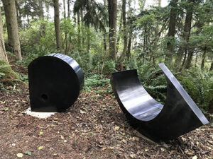 Sculptor MacRae Wylde sculpture Inside Out 14 and 15 at Price Sculpture Forest in Coupeville on Whidbey Island