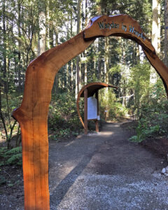 Wander In Wonder entry arch at Price Sculpture Forest sculpture park Coupeville Whidbey Island