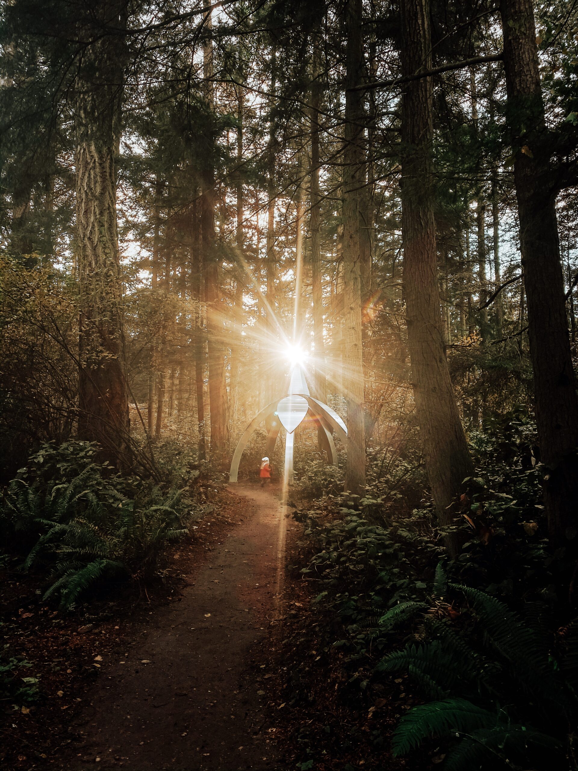 Gary Gunderson Pentillium with sun and 4 year old daughter Hanna Nalani at Price Sculpture Forest - photo by Stacey Glass