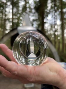 Larry Symons of Bellingham photo of Gary Gunderson Pentillium through glass ball at Price Sculpture Forest