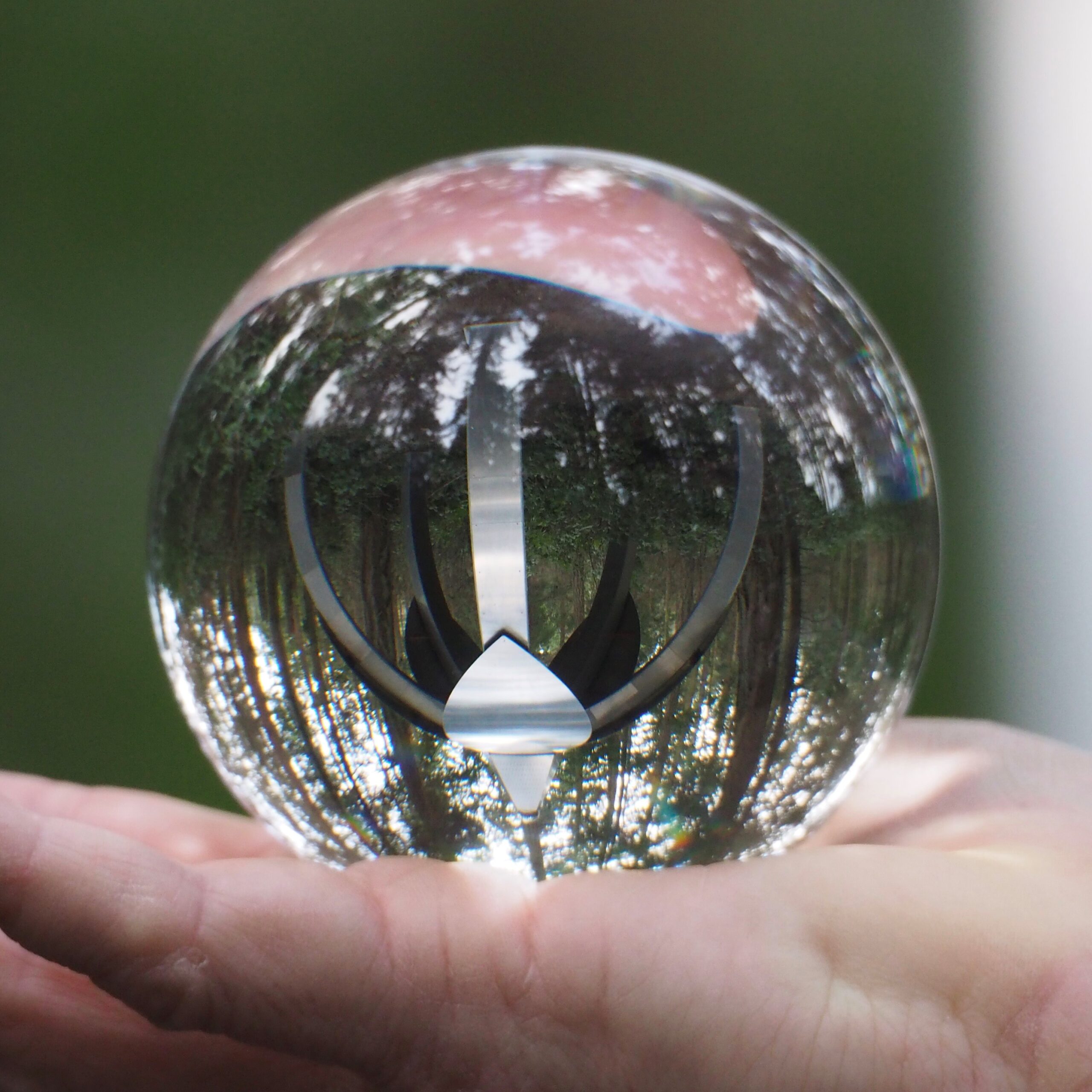 Larry Symons of Bellingham photo of Gary Gunderson Pentillium through glass ball closeup at Price Sculpture Forest