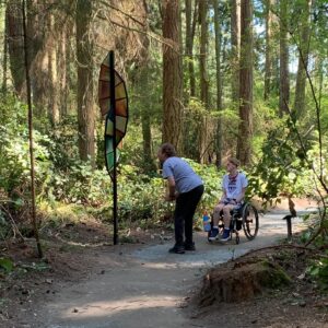 Shane and Xander observing Kirk Seese The Feather at Price Sculpture Forest photo by Martin Pearce of Bellevue WA