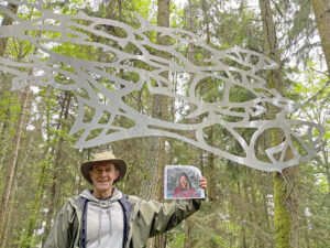 Scott Price with honorary onsite photo of Daniella Rubinovitz by her Flying Fish at Price Sculpture Forest
