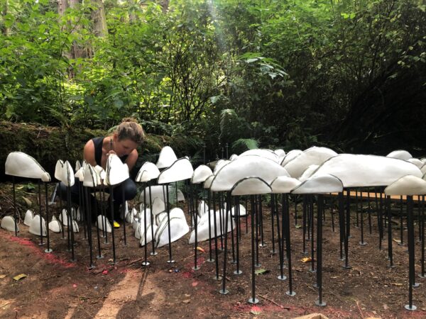 Jenni Ward working on Lichen Series Spore Patterns ceramic sculpture installation at Price Sculpture Forest