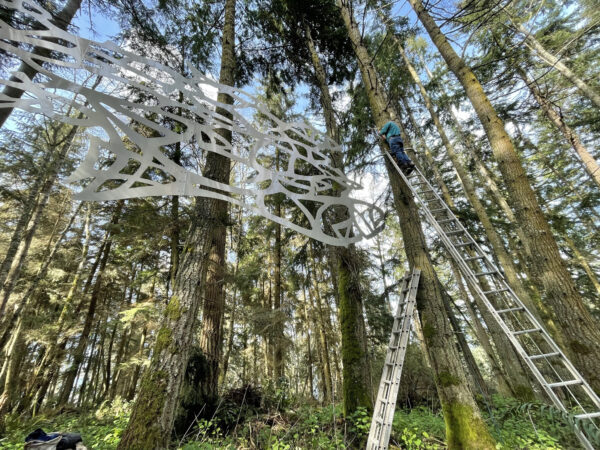 Dick DeLay working on Flying Fish by Daniella Rubinovitz suspension system at Price Sculpture Forest