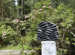 We Are Water by Sue Taves with blooming rhododendrons at Price Sculpture Forest
