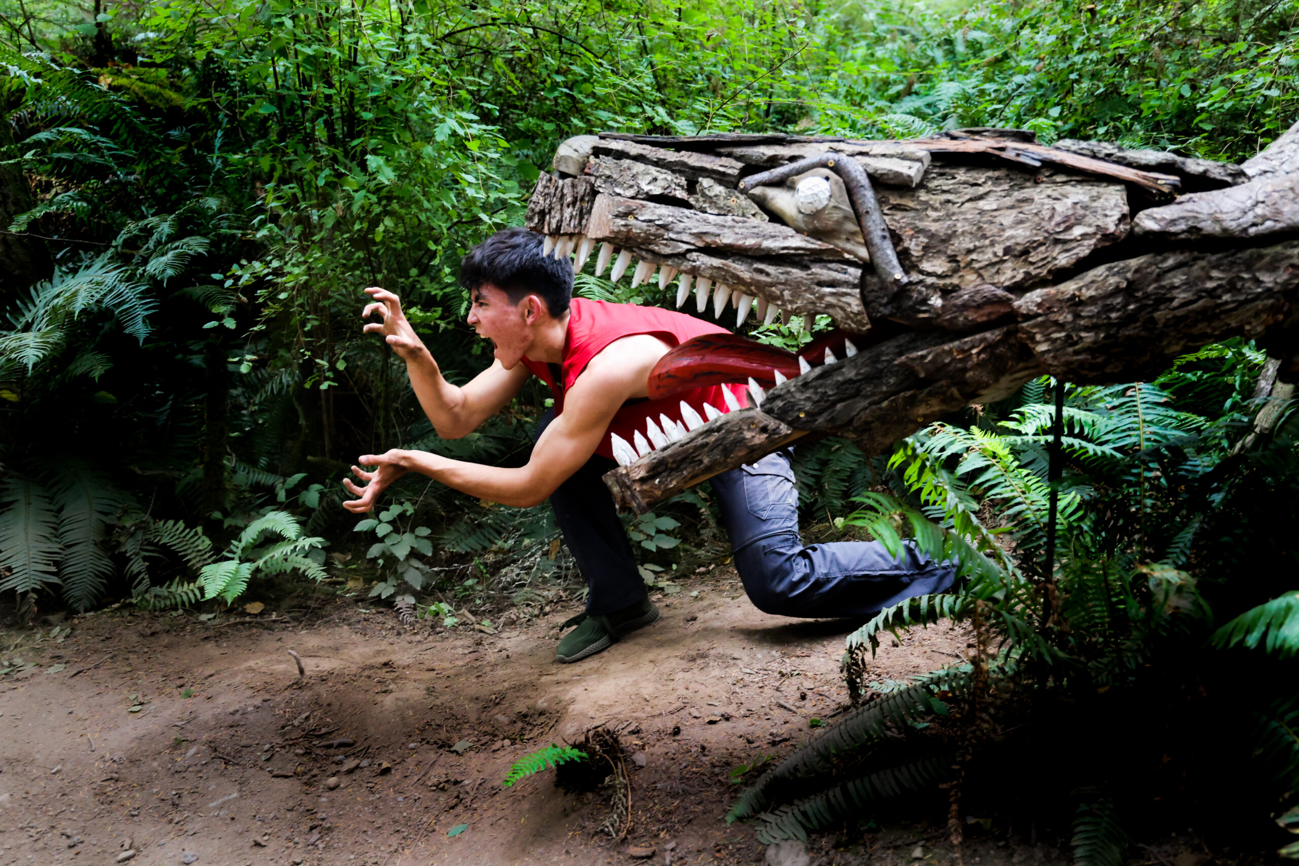 Dancer Joh Morrill at T-Rex by Joe Treat - WANDER WONDER 2022 photo by T Lefferts at Price Sculpture Forest