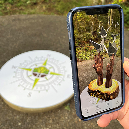 Inciting Hope by William Baran-Mickle on AR app while showing actual pedestal behind it at Price Sculpture Forest