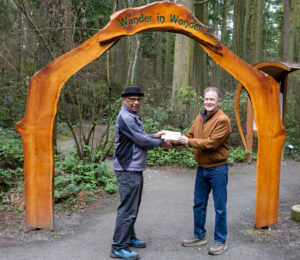 Whidbey Island Arts Council WIAC president David Hundley gives grant to Price Sculpture Forest