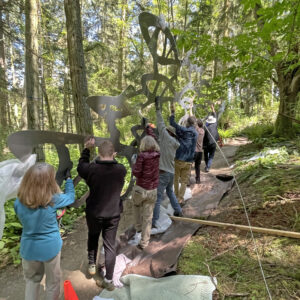 Volunteers installing sculpture at Price Sculpture Forest